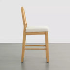 Sgabello da bancone Boho in rattan Spruce&Spring con schienale curvo in rattan e seduta imbottita