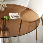 Tavolo da pranzo rotondo Afton Mid-Century Modern con piano in vetro temperato e base svasata color argento